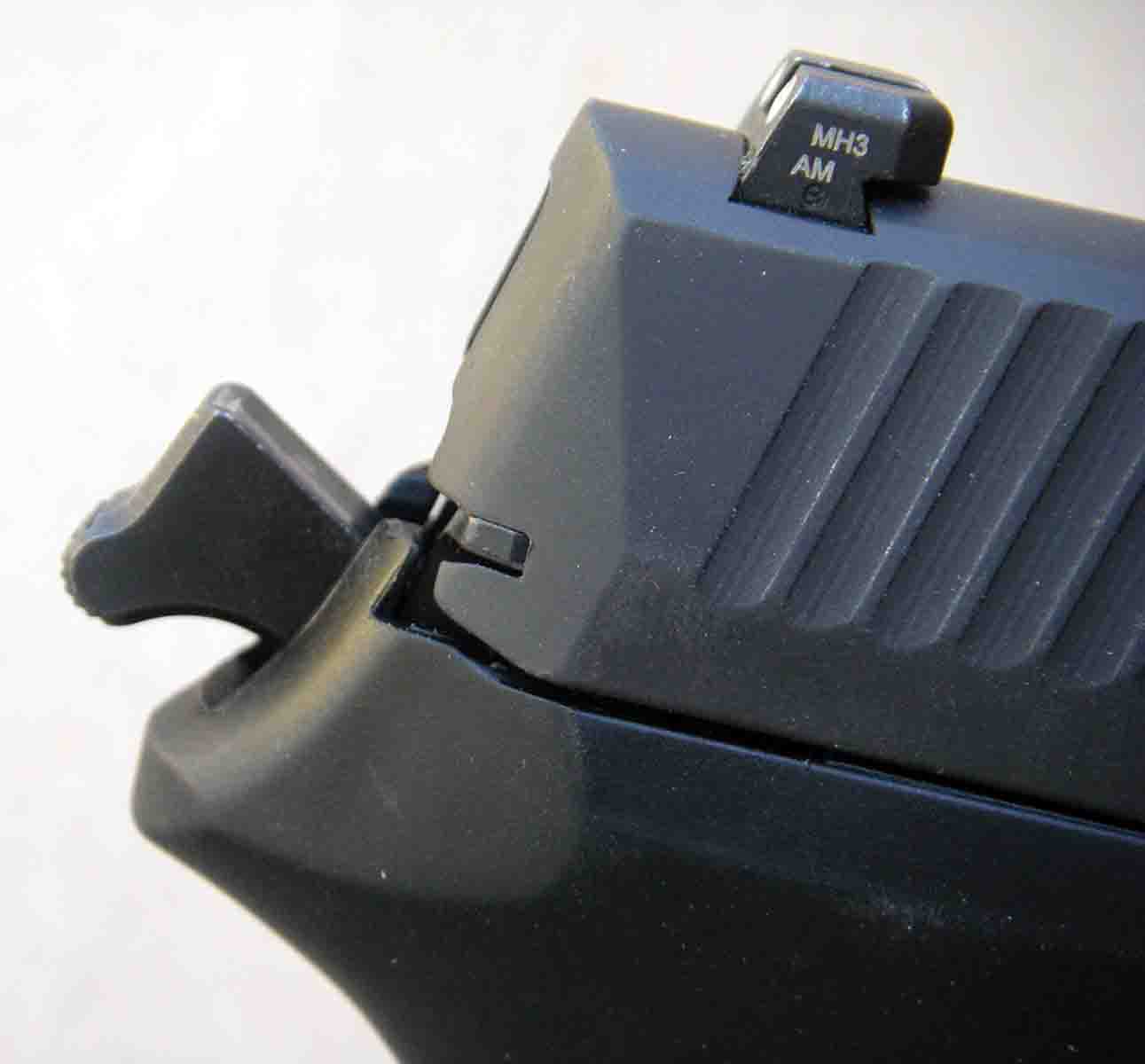 The pistol features an external hammer.